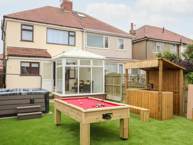 Rear view of 71 Nutter Road with hot tub, conservatory and outdoor pool table.