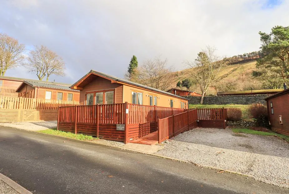 Lakeland View Lodge with fenced decking and hillside views in the background