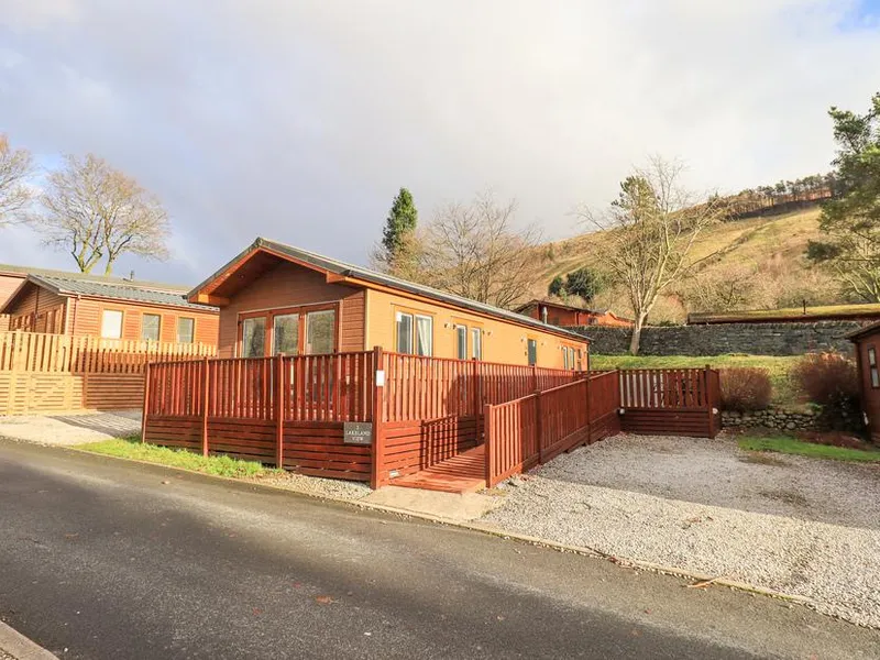 Lakeland View Lodge with fenced decking and hillside views in the background
