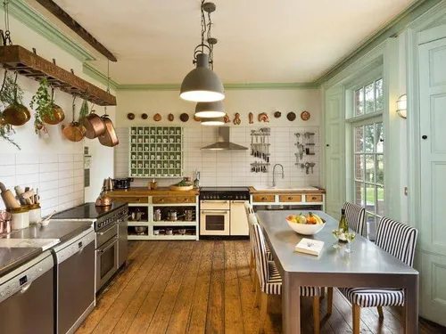 Cottage kitchen with wooden floor, dining table and hanging pots